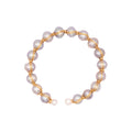 Pearl bracelet with gold wire on a white background